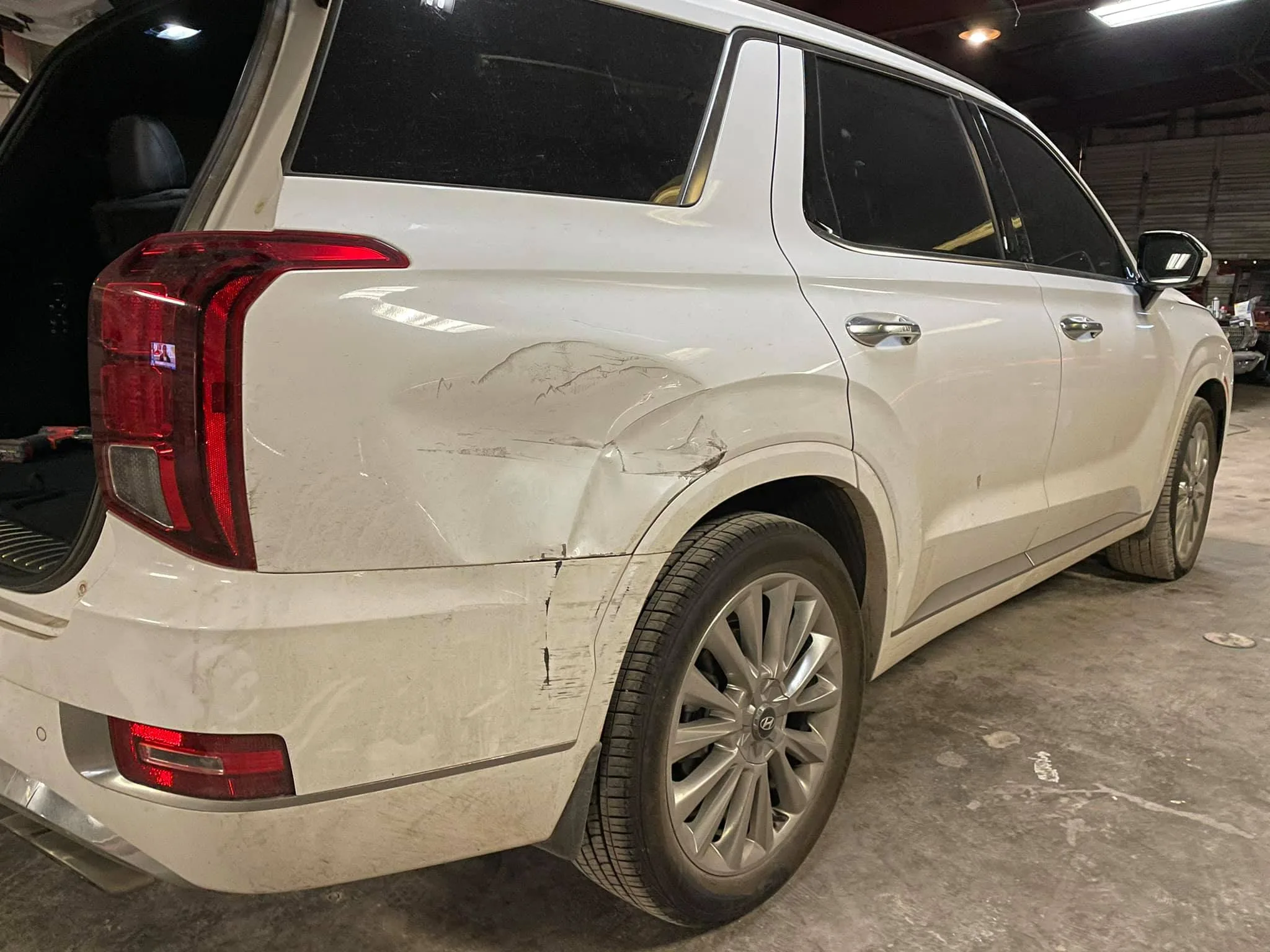 Before: rear quarter panel damage