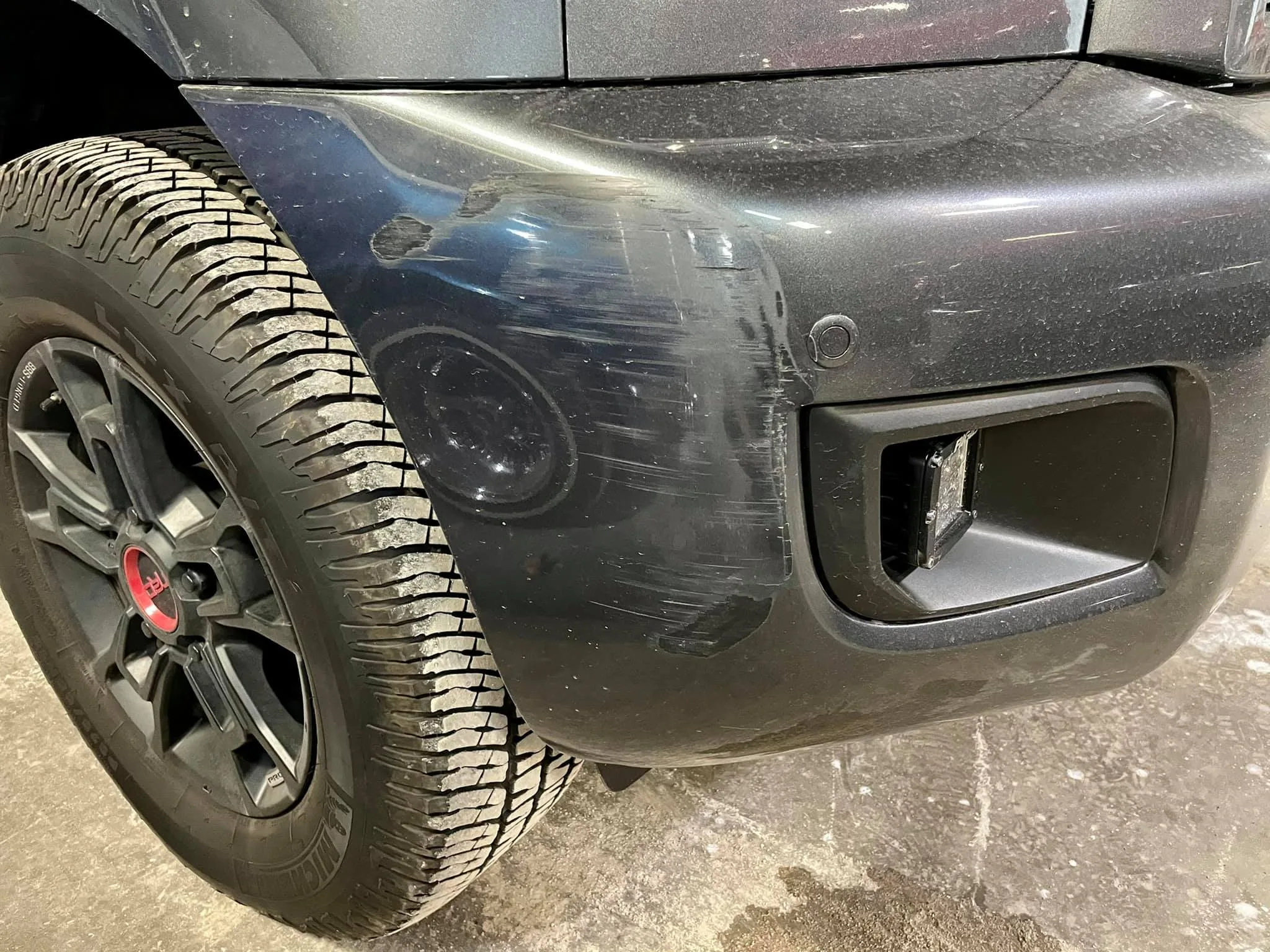 Before: SUV with body damage prior to repair at The Works Paint and Collision
